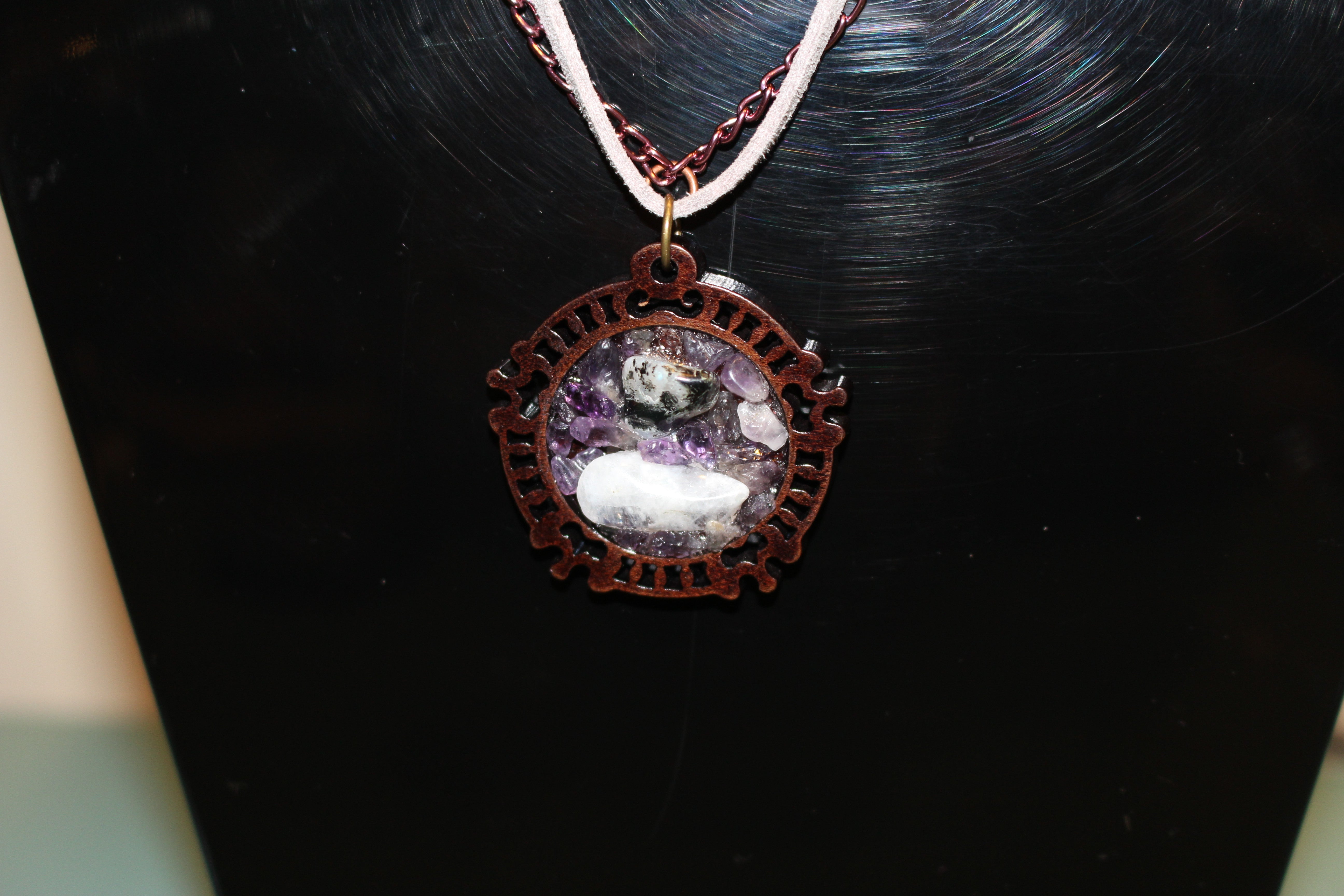 Amethyst and Moonstone wooden backing on silver leather cord and mixed metals to join.