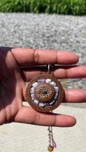 lepidolite with acorn on wood backing with seed bead cording